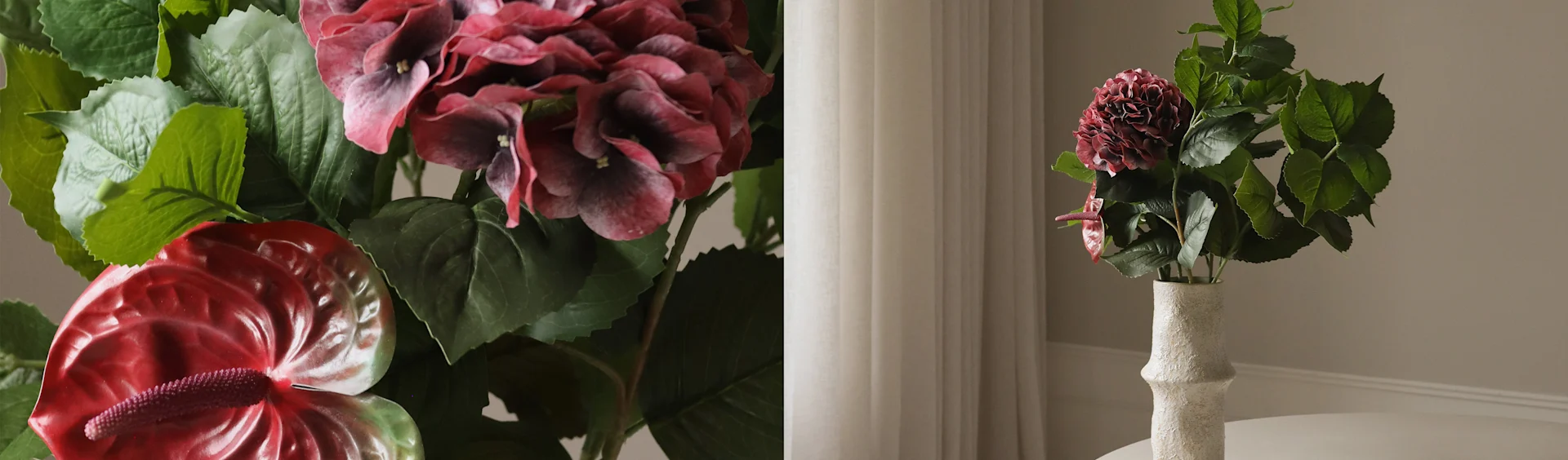 Kunstig mørkerød hortensia og røde anthuriumblomster i en teksturert hvit vase.